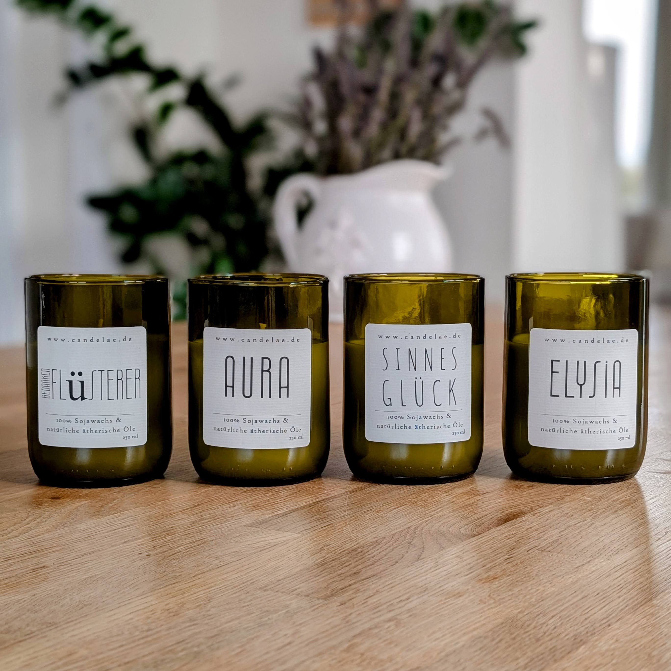 Exklusive Duftkerzen-Bundles von Candelae – handgegossen aus recycelten Weinflaschen mit natürlichen ätherischen Ölen, nachhaltige Kerzen im 4er-Set.